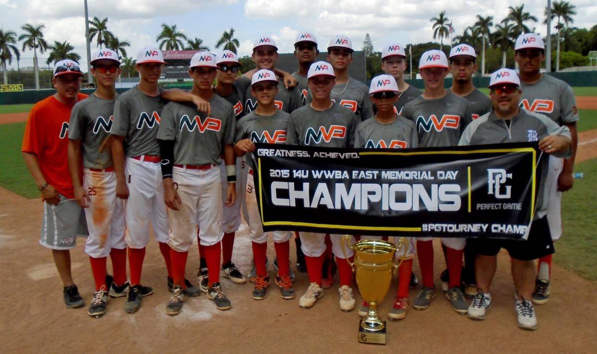 group of baseball players pose with trophy and championship sign