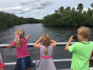 Kids look for marine life aboard the MV Edison Explorer on the Caloosahatche River