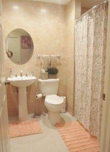 Photo 2 - A newly renovated bathroom with roll-in shower, comfort height toilet and pedestal sink