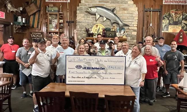 Cheering group from GulfShore Mustand Club donates large check to Lee BIA Builders Care