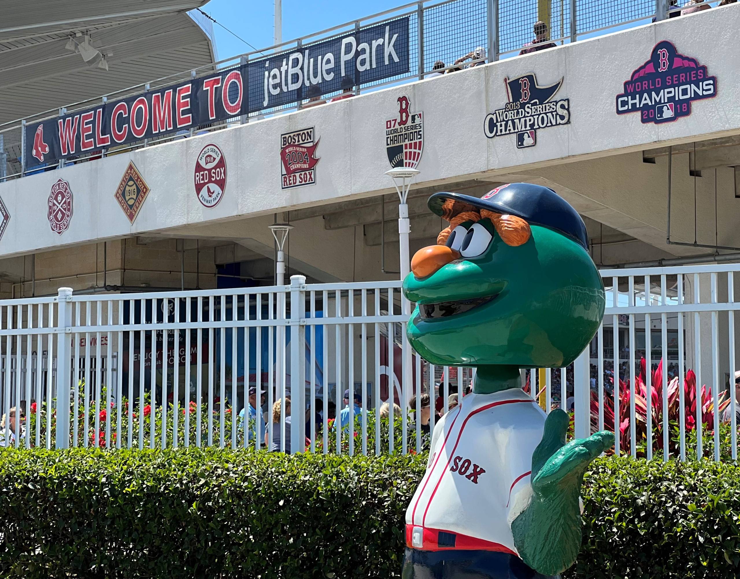 Statue of mascot in front of Welcome to jetBlue Park sign