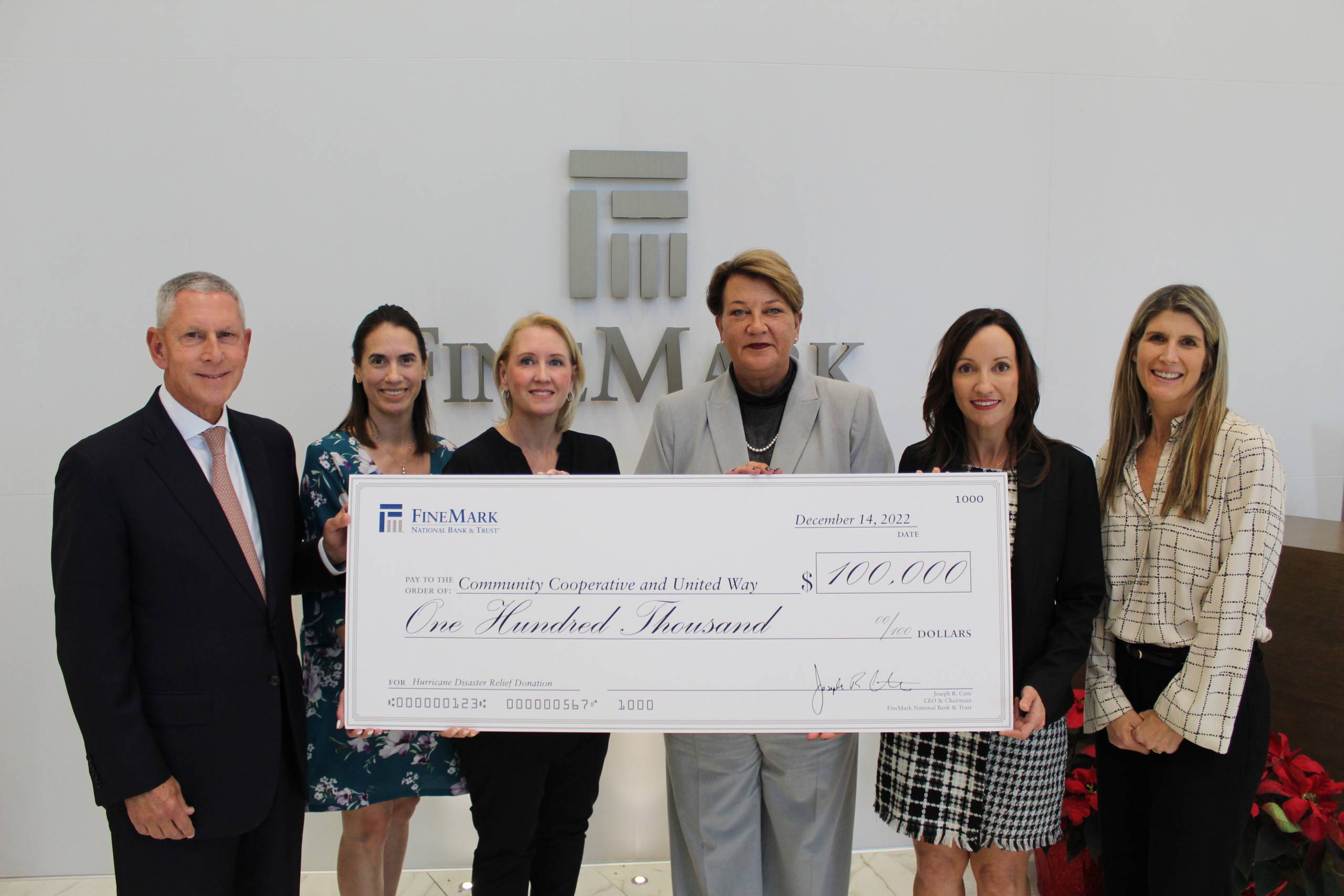 Check presentation from FineMark to Community Cooperative and United Way