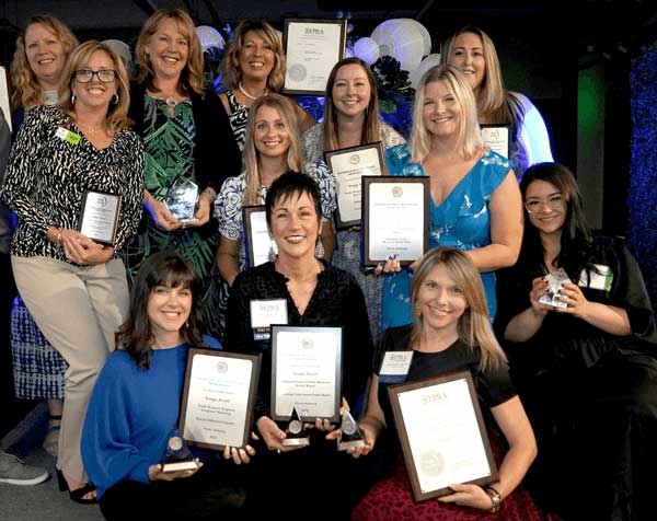Priority Marketing team of pros showing off their new FPRA awards