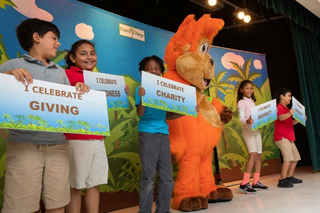 Children holding up signage during Charity for Change event