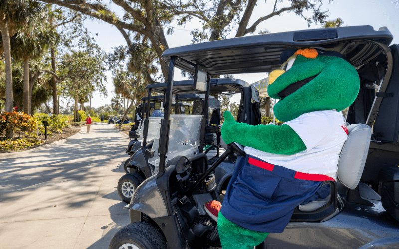 Wally the Red Sox mascot in a golf cart